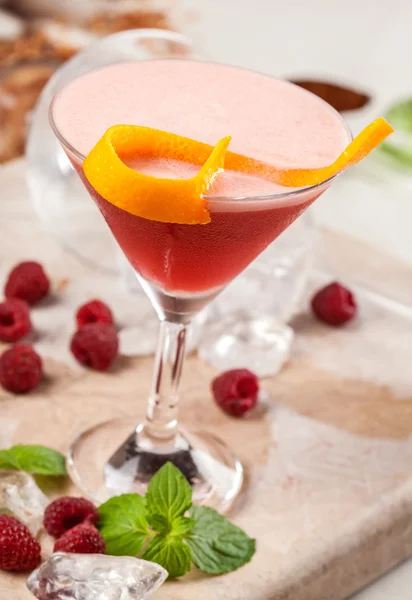 Red drink with raspberries and passion fruit — Stock Photo, Image