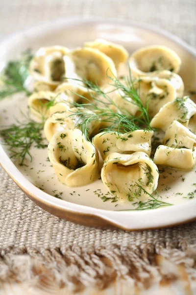 Salmon ravioli with dressing dill and lemon — Stock Photo, Image