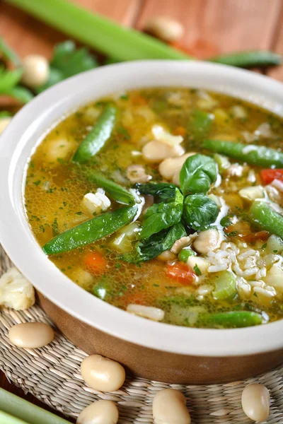 Bullion with pore and basil, vertical Stock Picture