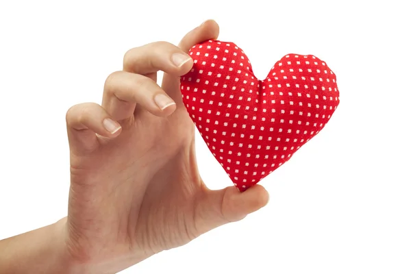 Mulher mão mantém casa feita de tecido recheado coração vermelho. Dia dos Namorados — Fotografia de Stock