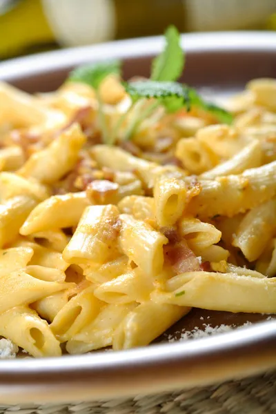 Macaroni with bitter dressing, carbonara sauce — Stock Photo, Image