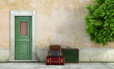 Old house with vintage suitcases