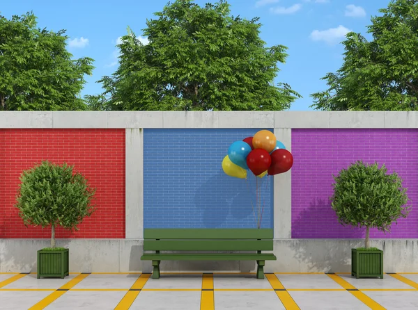 Street with bench and colorful balloons — Stock Photo, Image