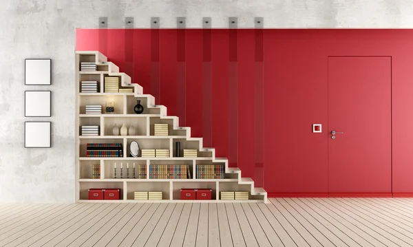 Червоний вітальня з дерев'яними сходами і шафи для книг — стокове фото