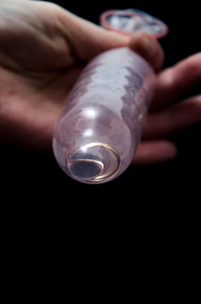 Condom and Wedding Ring — Stock Photo, Image