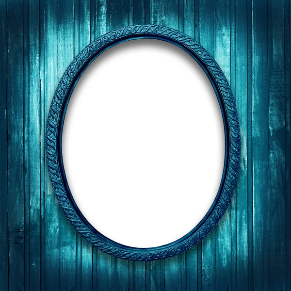 Frame for a picture at the grunge a wooden background — Stock Photo, Image