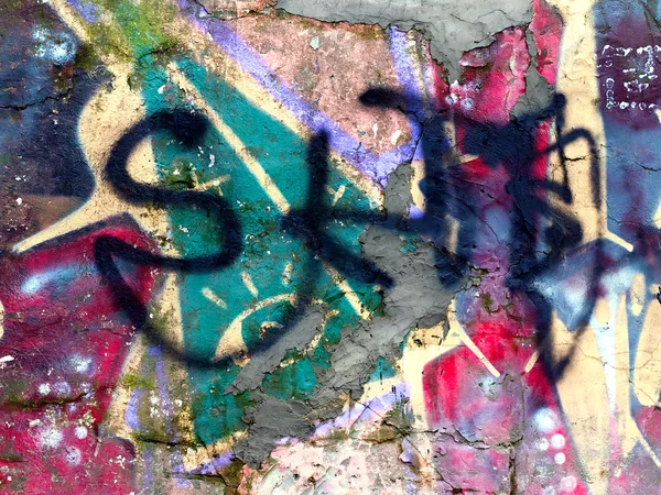 Piece of graffiti images on an old brick wall — Stock Photo, Image