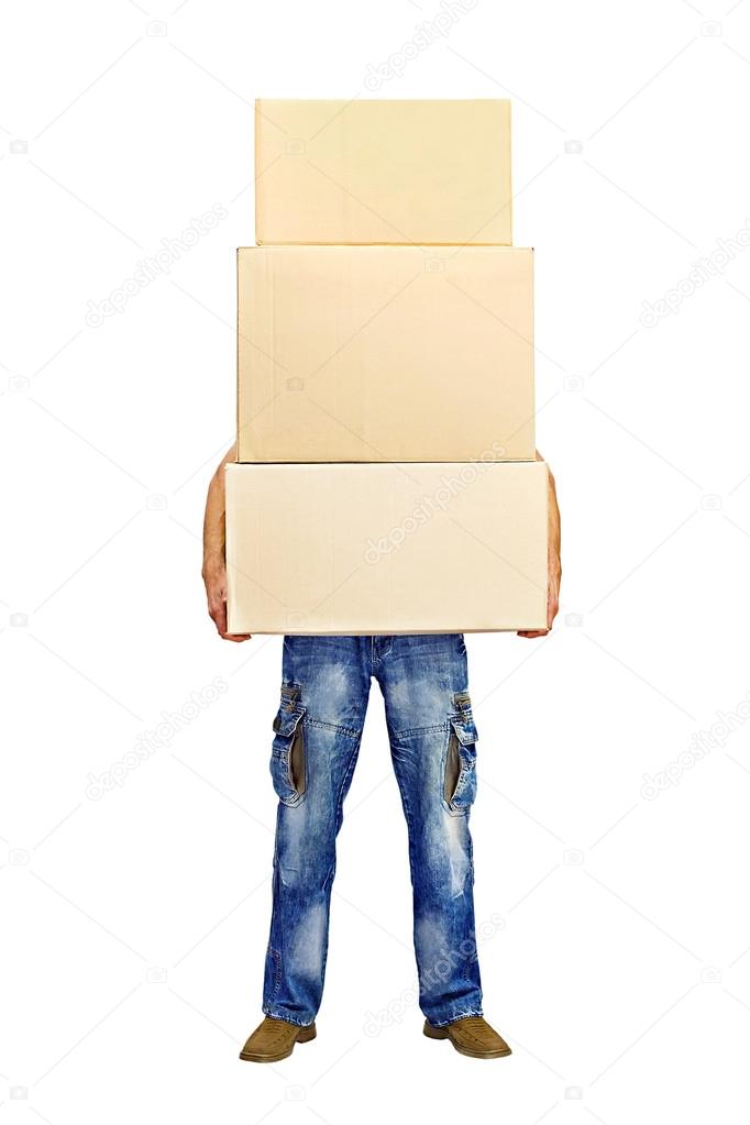 Man holding a stack of cardboard boxes