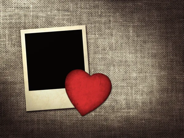 Polaroid-style photo and red paper heart on a linen background — Stock Photo, Image