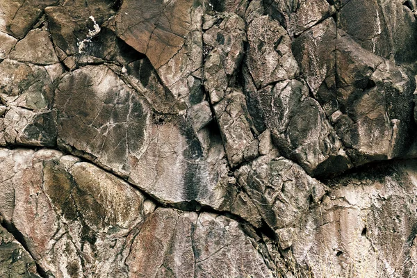 Výstřední šedé kamenné pozadí se praskliny — Stock fotografie