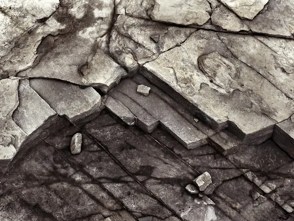 Cracked stone rock in the style of grunge — Stock Photo, Image