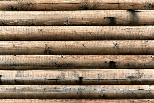 Grungy background of cylindrical logs — Stock Photo, Image