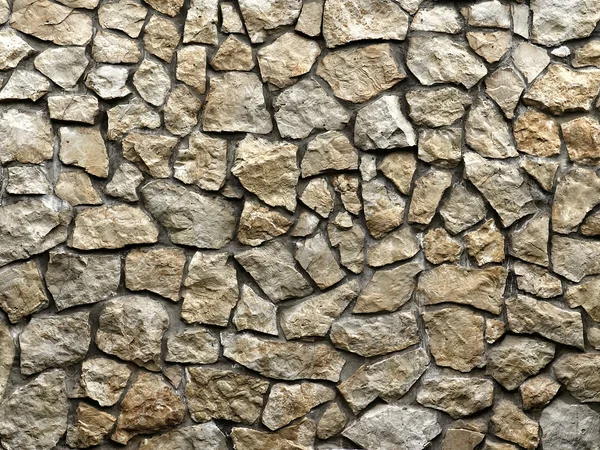 Old grunge wall of rough stones as background — Stock Photo, Image