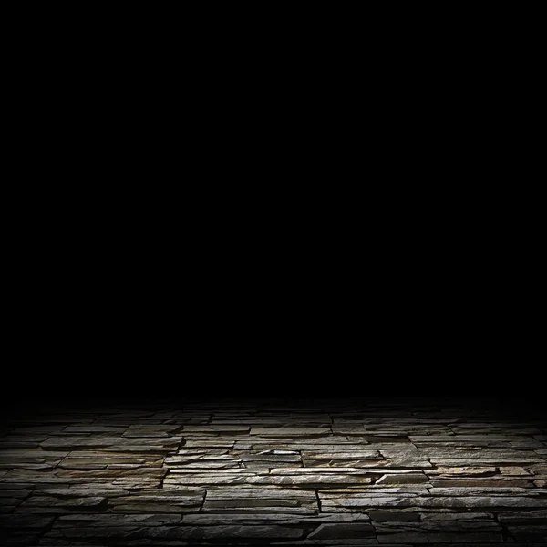 Illuminated stone floor on a black background — Stock Photo, Image