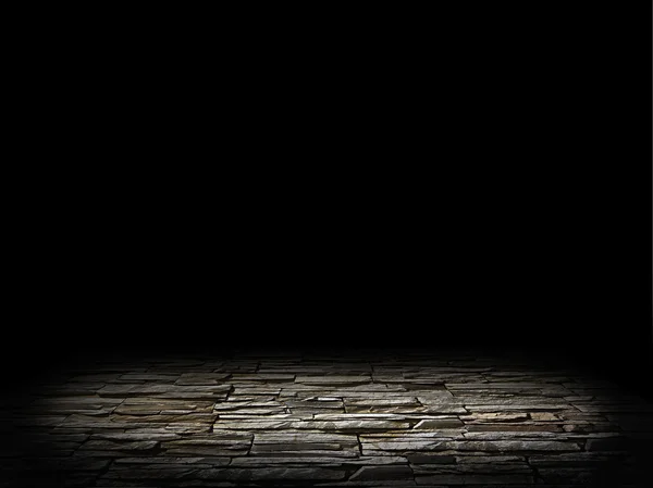 Oświetlony kamienne podłogi na czarnym tle — Zdjęcie stockowe