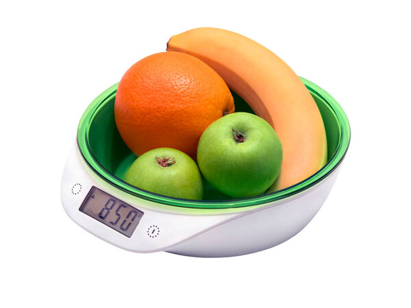 weighing fruit for diet on electronic scales. isolated on white