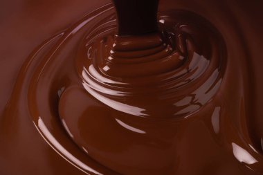 Biraz erimiş çikolata. Tatlı kakao tatlısı, koyu çikolata arkaplan