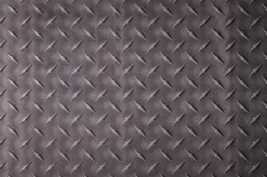 kaba çelik desenli, kıvrımlı desenli. koyu metal arkaplan.