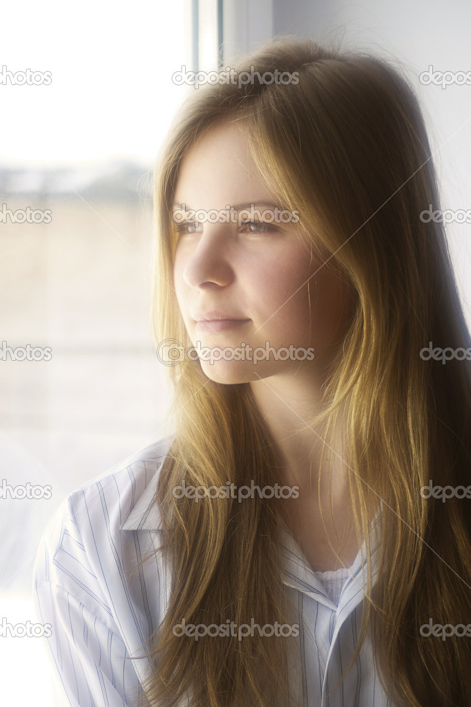 Portrait of a girl at the window
