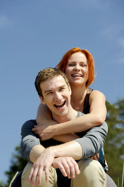 Portrait of a young beautiful happy couple outside — Stock Photo, Image