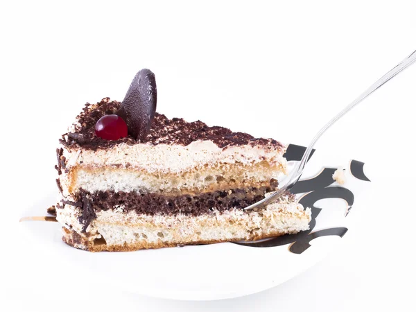 Pedazo de pastel acostado en un plato — Foto de Stock