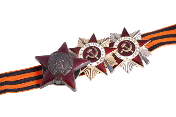 Nagrody z ZSRR. Order Wojny Ojczyźnianej pierwszego i drugiego stopnia oraz kolejność czerwona gwiazda na tło wstążka st. george's — Zdjęcie stockowe