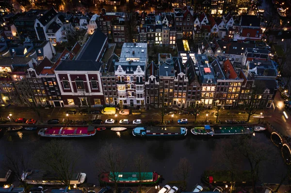 Houses on the Banks of the Canals of Amsterdam at Night