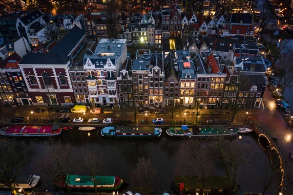 Waterfront Houses at Night in Amsterdam Aerial View