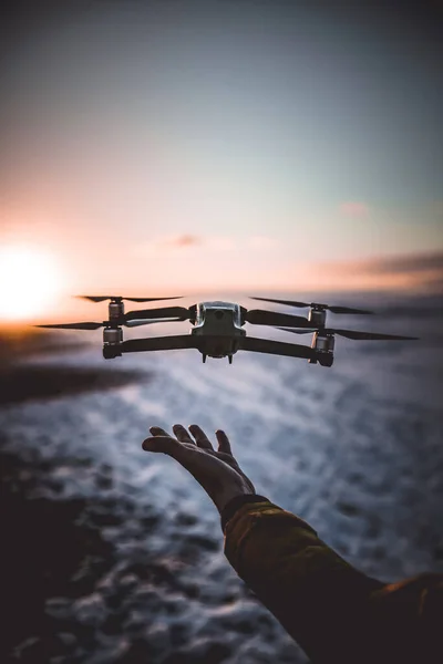 A Drone Taking Off From the Palm