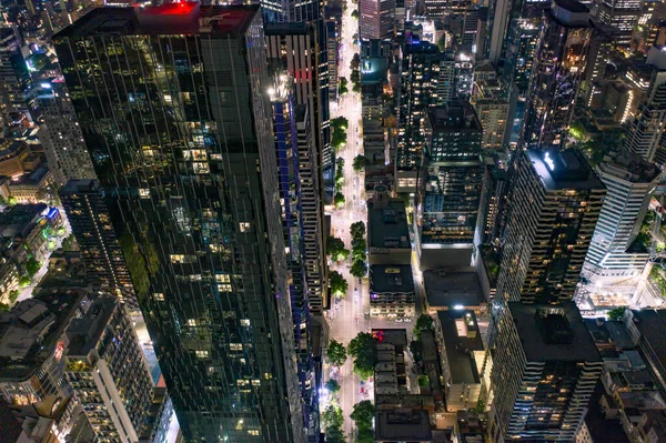 City Streets Night Surrounded High Rise Buildings Skyscrapers — Stock Photo, Image