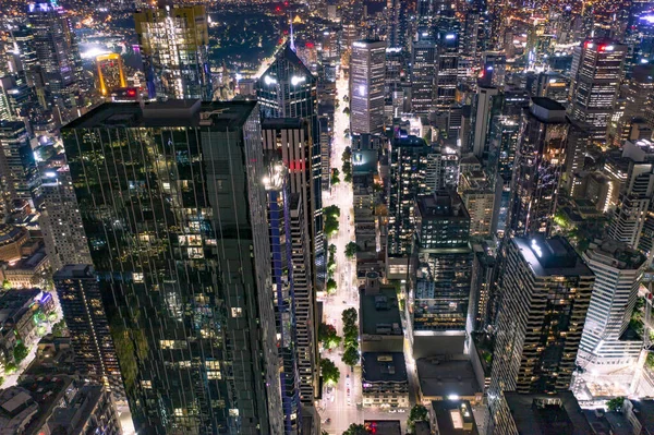 City Streets Night Surrounded High Rise Buildings Skyscrapers — Stock Photo, Image