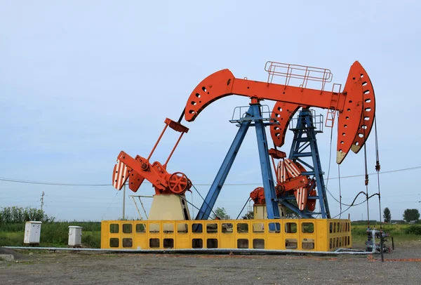 Oil pumping unit in working — Stock Photo, Image