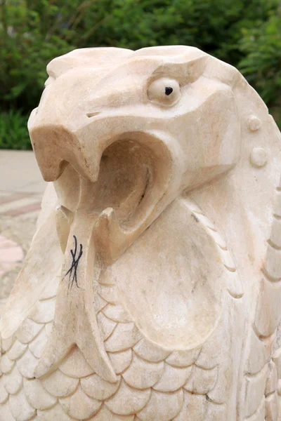 Animal model stone sculpture in a park — Stock Photo, Image