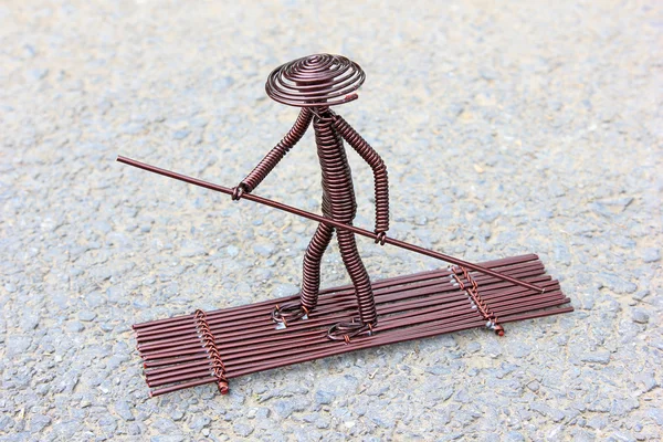 Toy crafts boatman made of copper wire — Stock Photo, Image