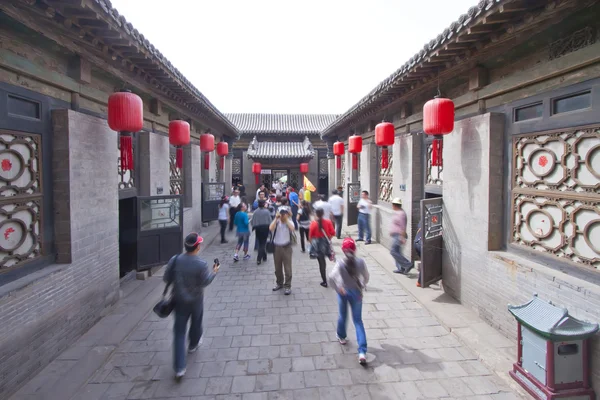 Qixian, China: May 19, 2011, Shanxi Qixian, visitors in a courty — Stock Photo, Image