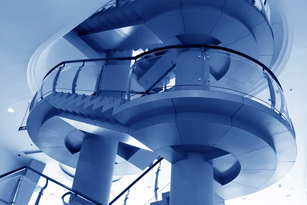 City indoor glass rotary stairs — Stock Photo, Image