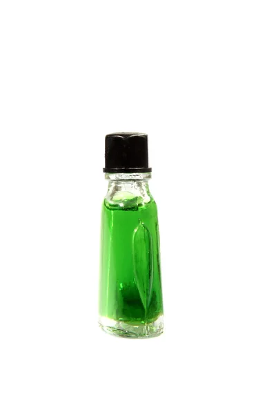 Green liquid in glass bottles — Stock Photo, Image