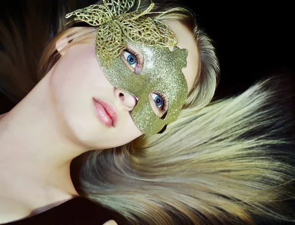 Closeup a woman face in a yellow mask — Stock Photo, Image