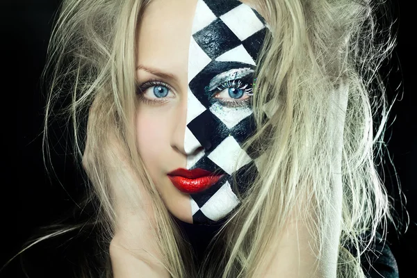 Closeup of woman with chess pattern on face — Stock Photo, Image