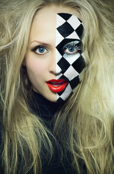 Closeup of model with a chess pattern on her face — Stock Photo, Image