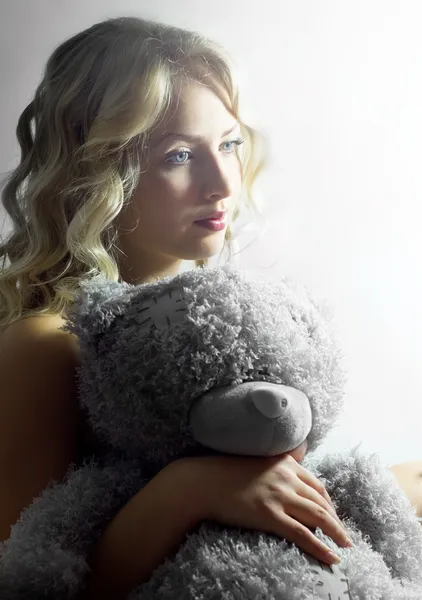 Pretty young girl with teddy bear — Stock Photo, Image