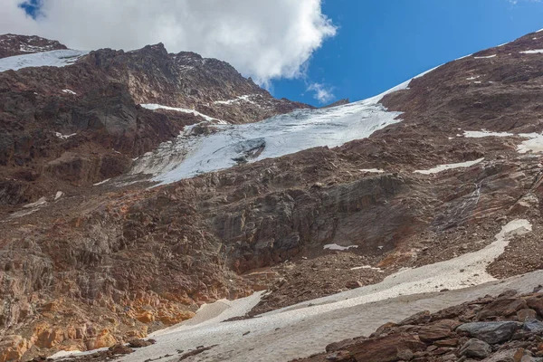 Last remnants of the rapidly retreating Fontana Glacier. The glacier is in rapid retreat caused by global warming. Vallelunga, Alto Adige, Italy. Popular mountain with climbers