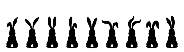 Дев'ять різних силуетів великодніх кроликів ізольовані на білому тлі . — стоковий вектор