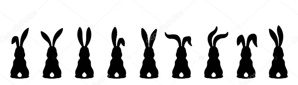 Nine different silhouettes of Easter bunnies isolated on a white background.