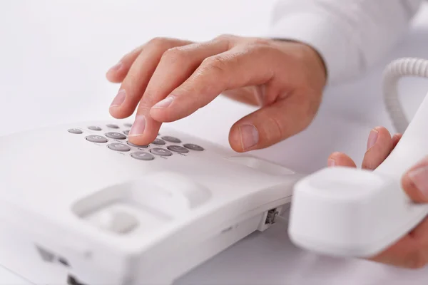 Mans hand working with a calculator — Stock Photo, Image