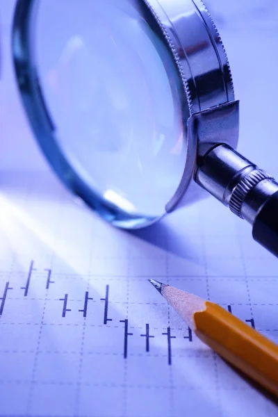 Graph, magnifying glass and pencil — Stock Photo, Image