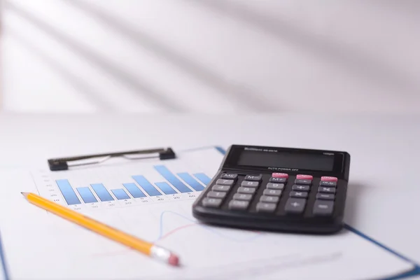 Bar graph and calculator — Stock Photo, Image