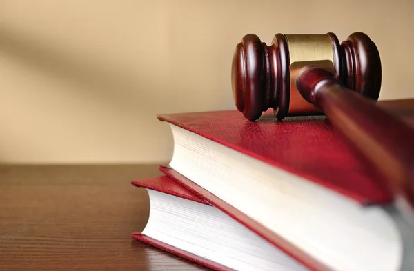 Wooden judges gavel on a law book — Stock Photo, Image