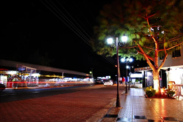 Night view of the street with shops