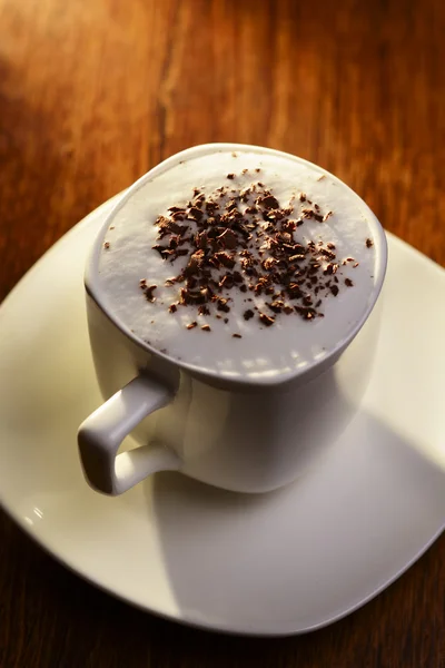 Frothy cup of cappuccino coffee — Stock Photo, Image